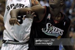 SAN ANTONIO, UNITED STATES:  Jerome Moiso of the Philadelphia 76ers (R) battles Cherokee Parks of the San Antonio Spurs (L) for a rebound during second half action at the Alamodome in San Antonio, TX, 16 October, 2001. AFP PHOTO/Paul BUCK (Photo credit should read PAUL BUCK/AFP via Getty Images)